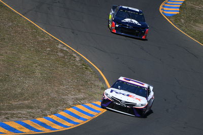 Martin Truex, Jr fends off teammate Kyle Busch for Sonoma race win