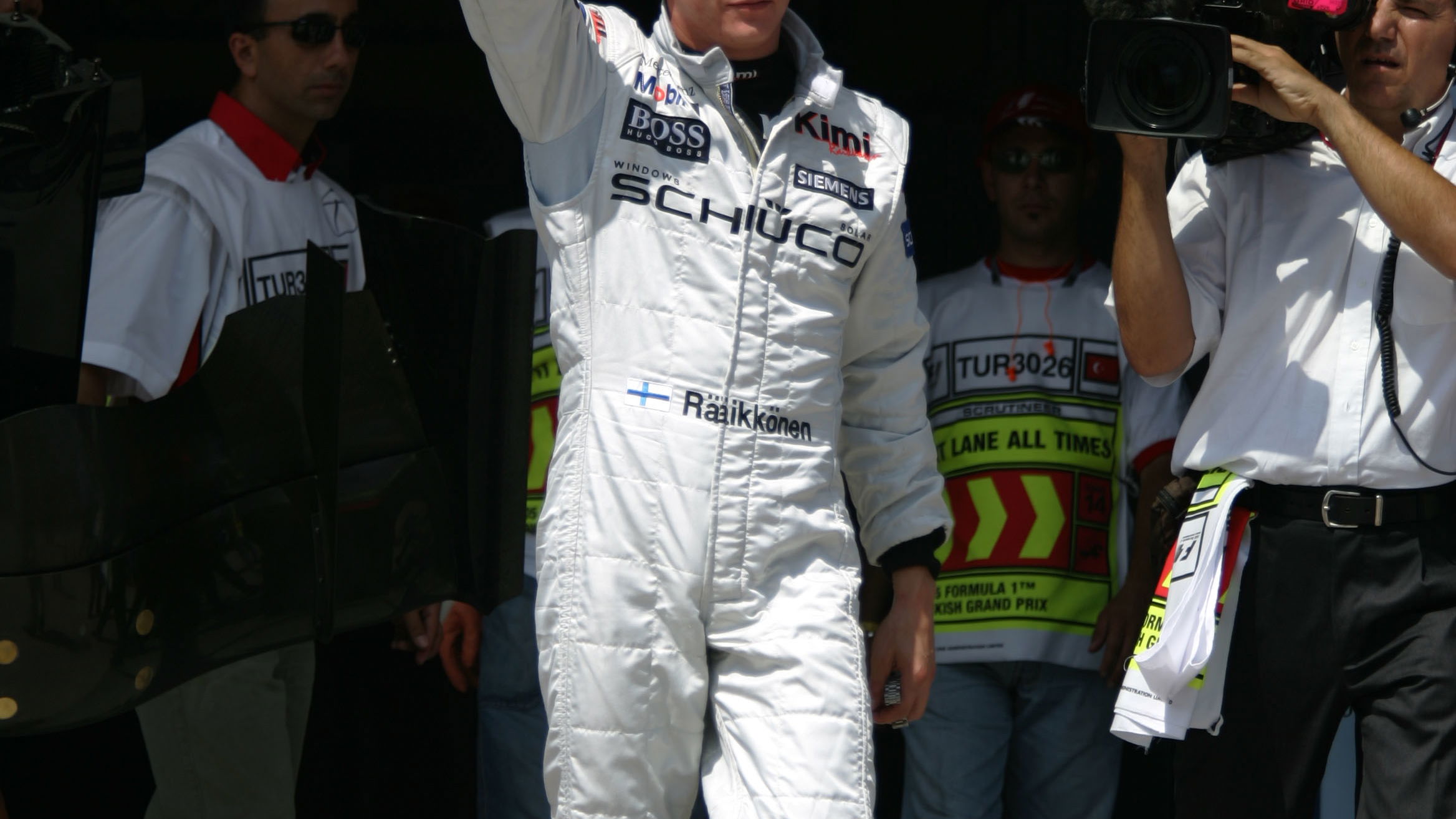 Kimi Raikkonen celebrates after taking pole position for the Turkish GP