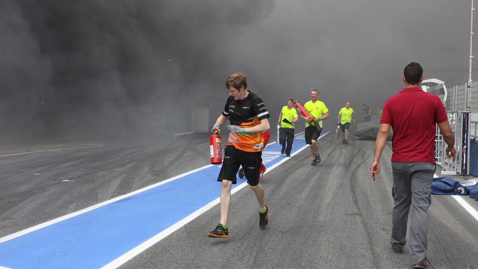 13.05.2012- A fire in the Williams pit garage after the celebrations is tended to by members of all