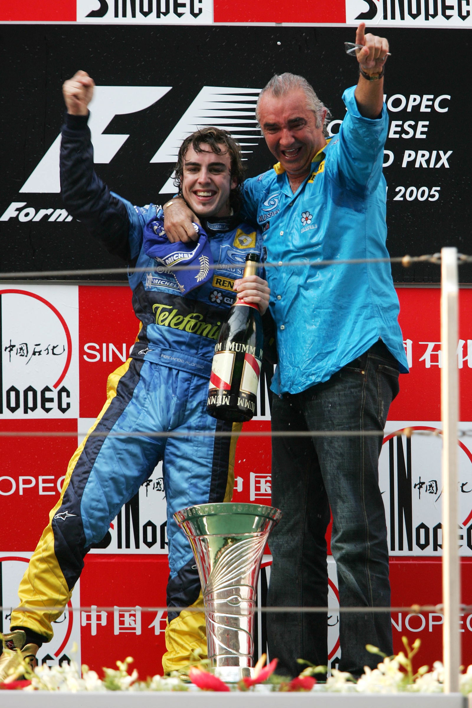 Chinese GP race winner Fernando Alonso and Flavio Briatore celebrate helping Renault to the construc