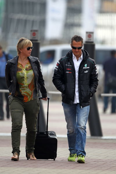 13.10.2012- Sabine Kehm (GER), Michael Schumacher's press officer and Michael Schumacher (GER) Merc