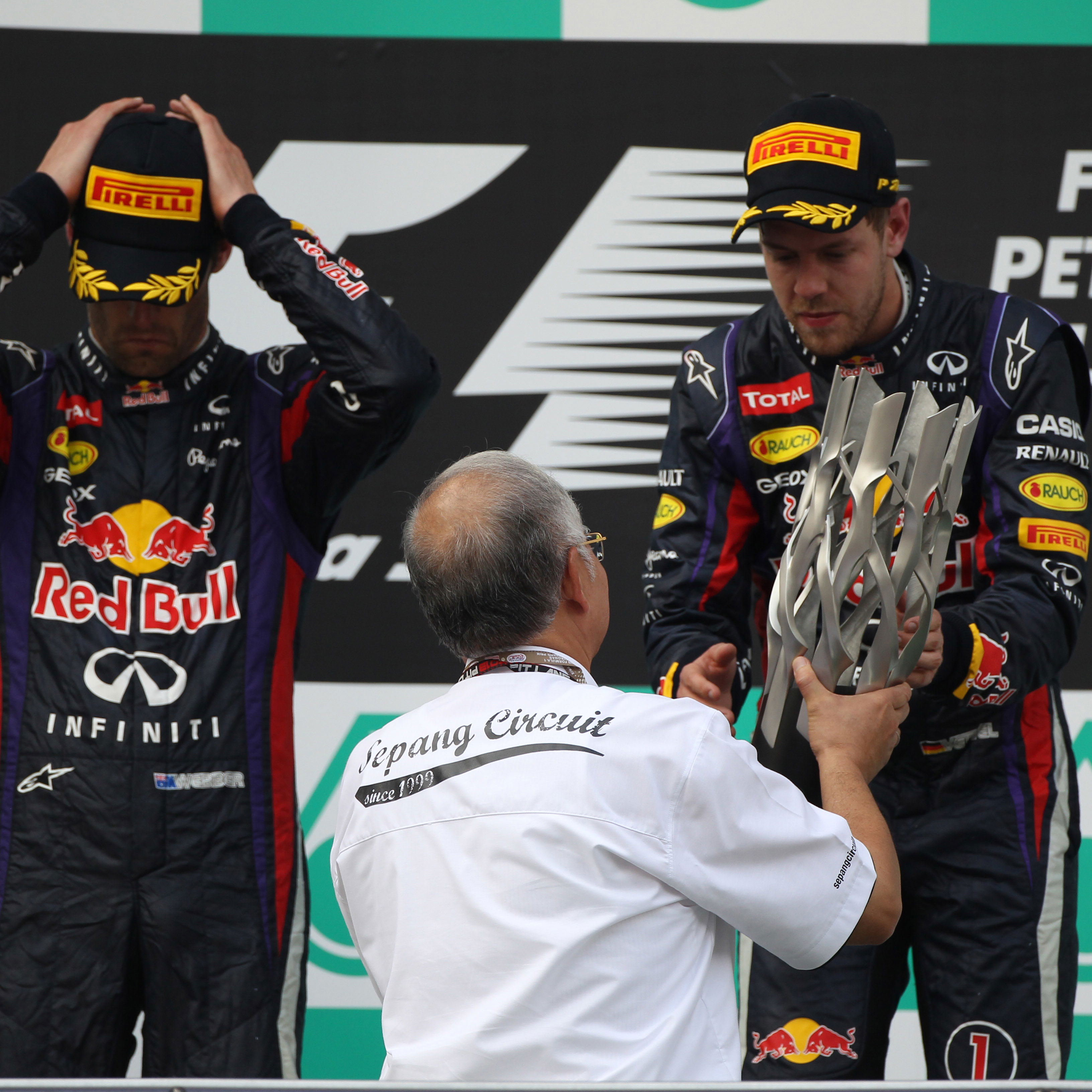 24.03.2013- Race, the podium; winner Sebastian Vettel (GER) Red Bull Racing RB9, 2nd Mark Webber (AU