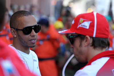 26.05.2013- Lewis Hamilton (GBR) Mercedes AMG F1 W04 and Fernando Alonso (ESP) Scuderia Ferrari F138