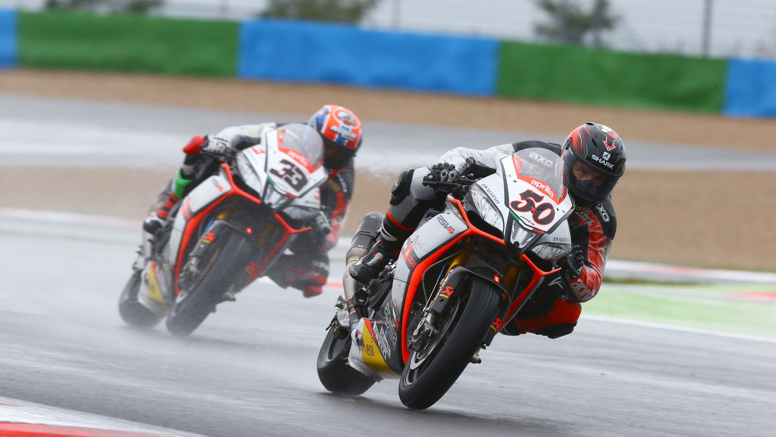 Melandri beats Guintoli to controversial win