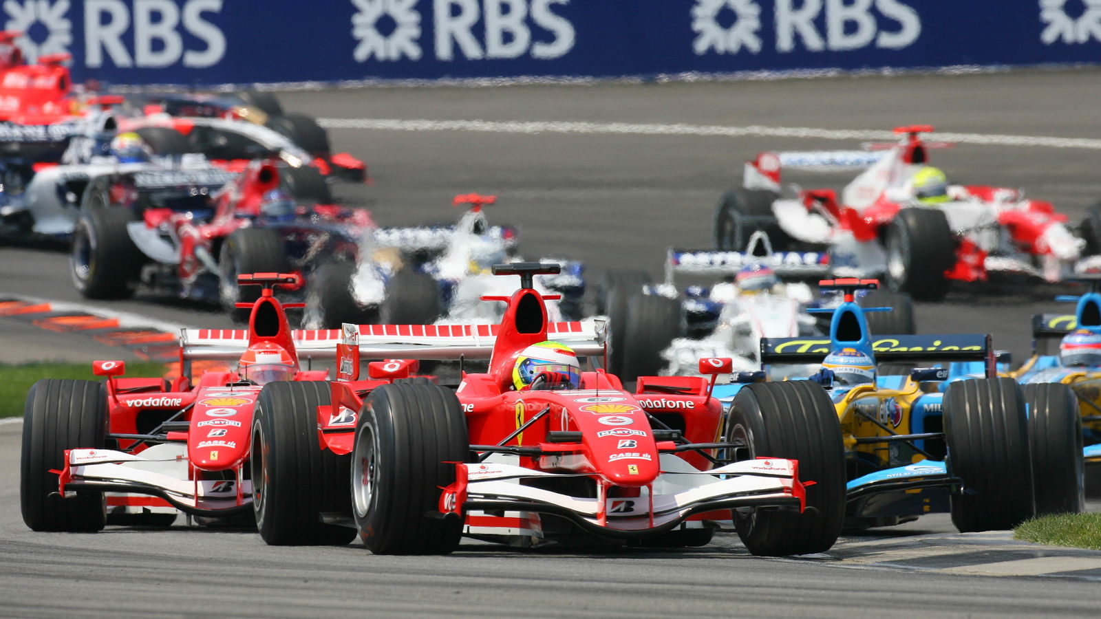 02.07.2006 Indianapolis, USA, Start, Felipe Massa (BRA), Scuderia Ferrari, 248 F1, leads Michael Sch