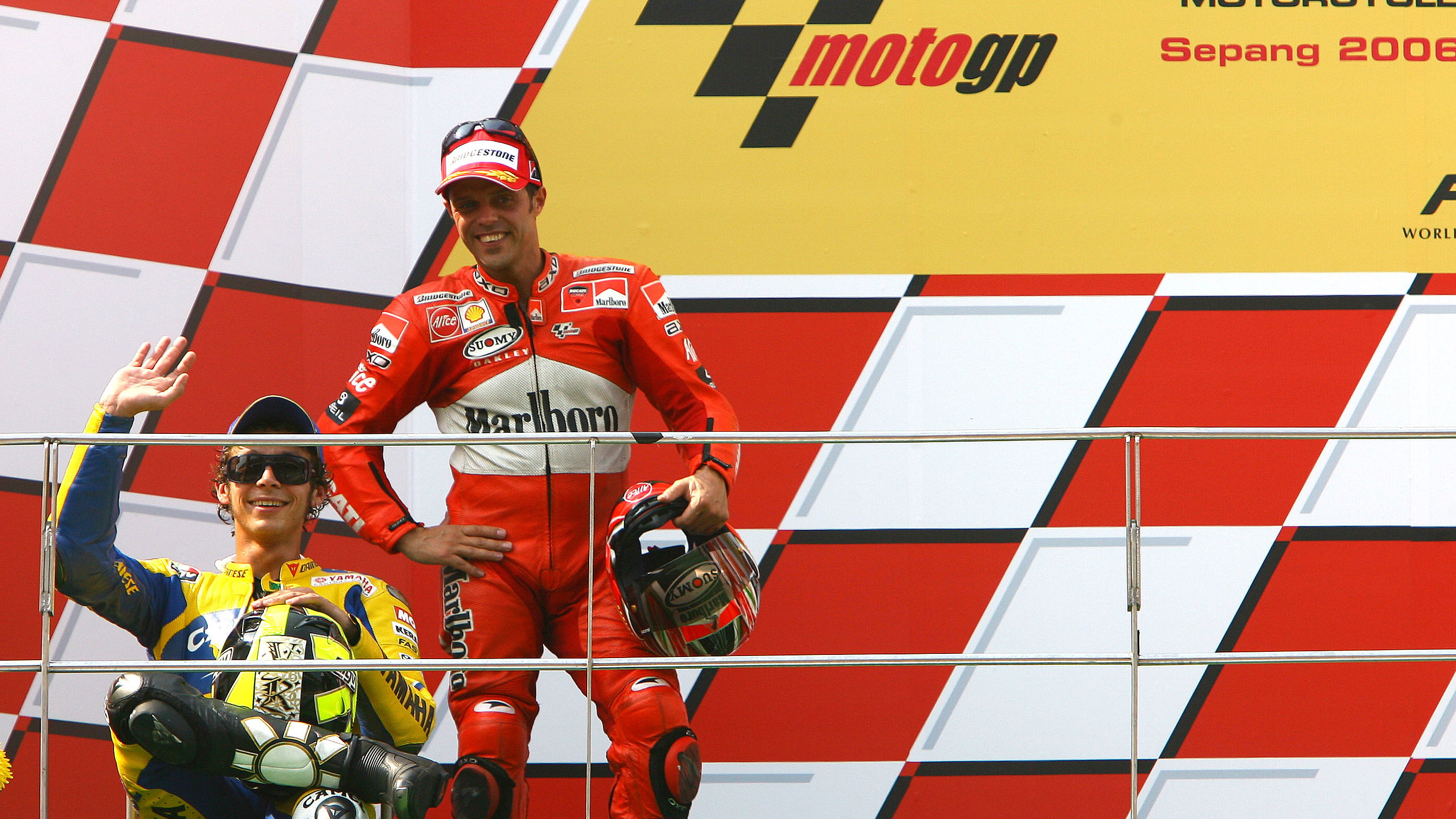 Rossi (1st) sits on chair on podium , Malaysian MotoGP 2006.