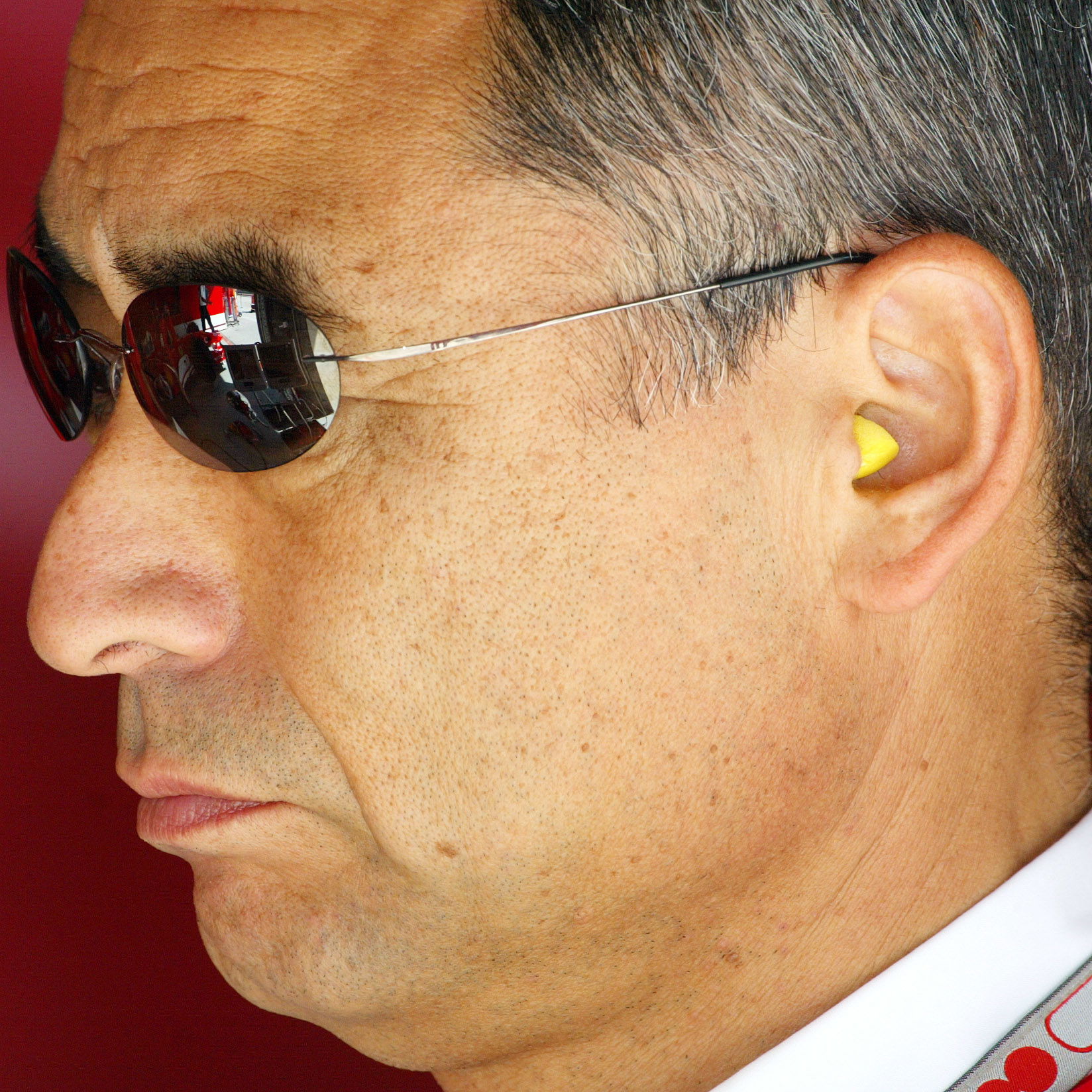 Mr Hiroshi Yazukawa of Bridgestone watches proceedings at the Chinese Grand Prix