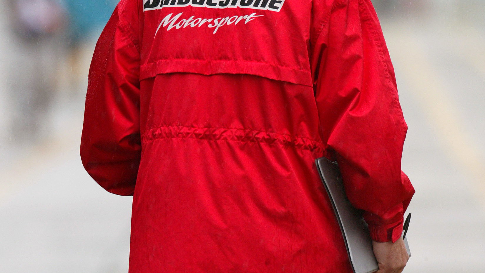 A Bridgesone tyre engineer studies the pit-lane conditions at the 2004 Japanese Grand Prix