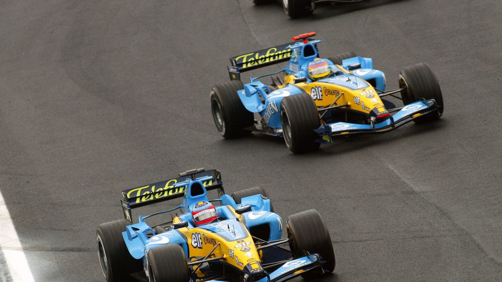Fernando Alonso rejoins the track in front of Jacques Villeneuve and David Coulthard - all three sta