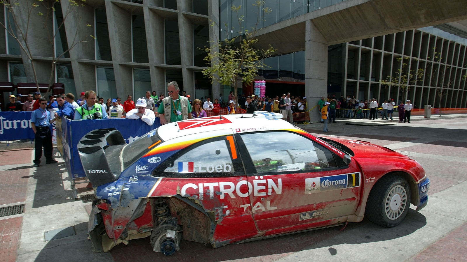 Citroen`s Sebastien Loeb limped his Xsara WRC back to service on three wheels after problems in the
