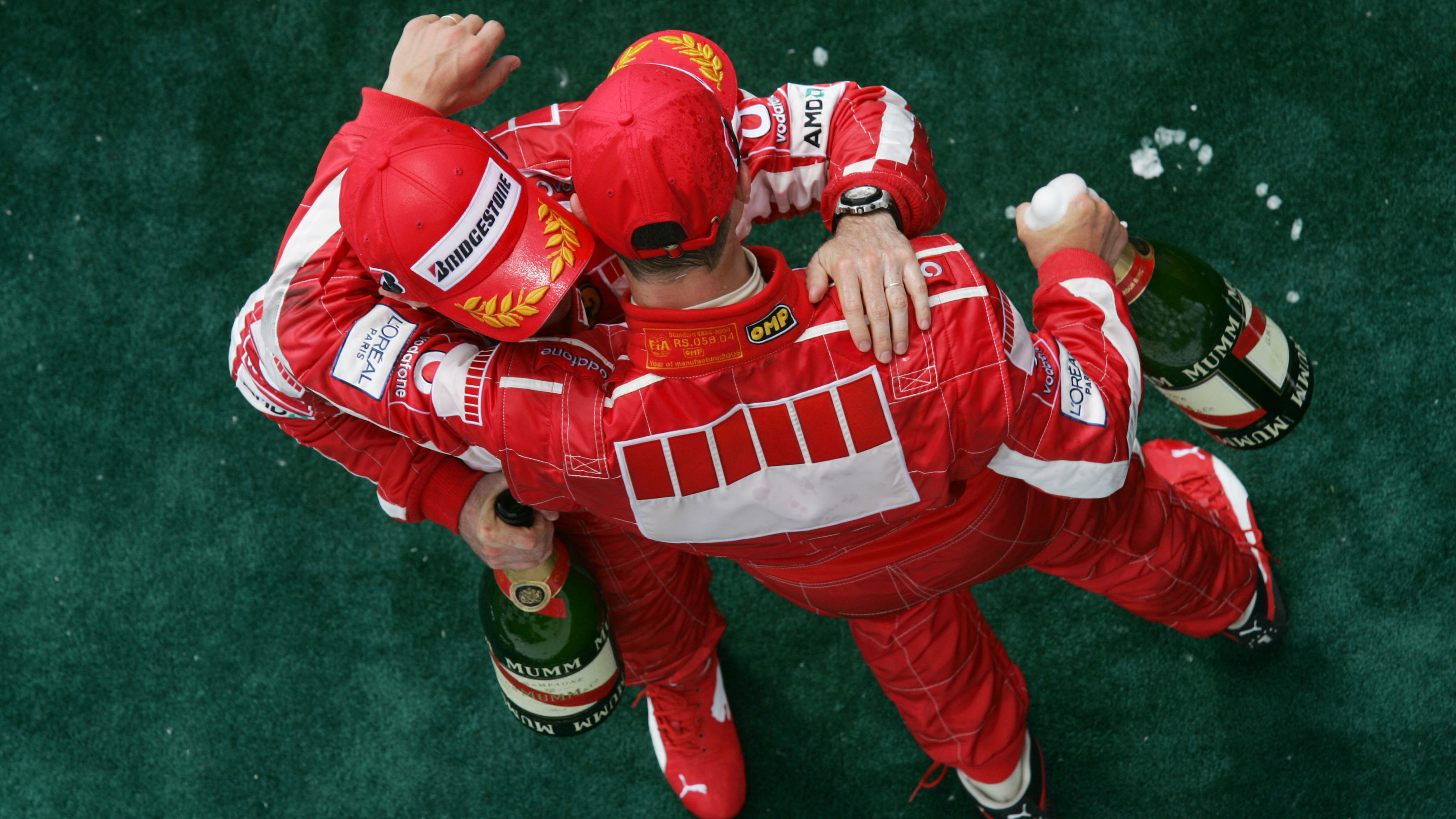 Michael Schumacher and Rubens Barrichello celebrate a Ferrari podium double in Canada