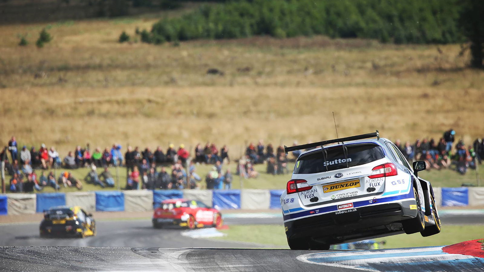 Sutton storms to race one victory