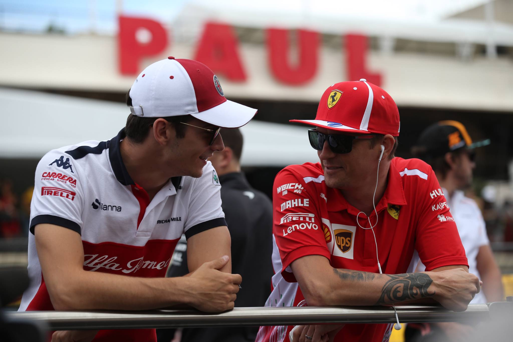 24.06.2018- Driver Parade, Kimi Raikkonen (FIN) Scuderia Ferrari SF71H with Charles Leclerc (GER) Alfa Romeo Sauber C37