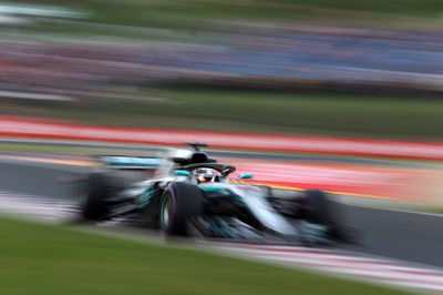 Hamilton storms to wet-weather pole in Hungary