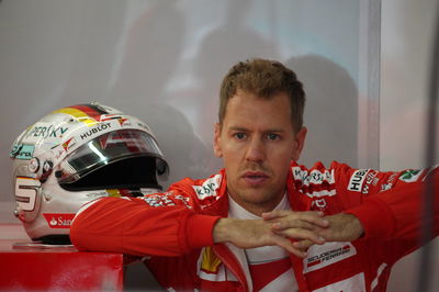 Vettel leads shortened Malaysia FP2 after Grosjean crash