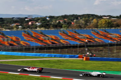 Antonio Giovinazzi (ITA) Alfa Romeo Racing C39 and Nicholas Latifi (CDN) Williams Racing FW43.