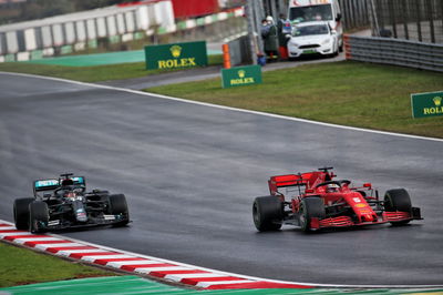 Sebastian Vettel (GER) Ferrari SF1000 and Lewis Hamilton (GBR) Mercedes AMG F1 W11.