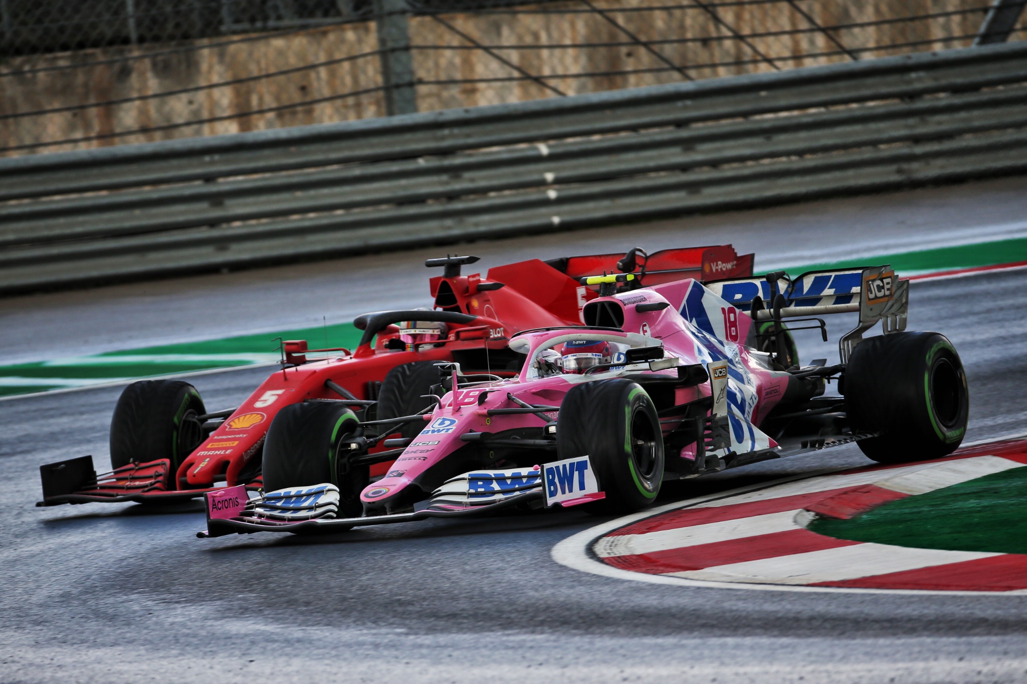 Lance Stroll (CDN) Racing Point F1 Team RP20 and Sebastian Vettel (GER) Ferrari SF1000 battle for position.