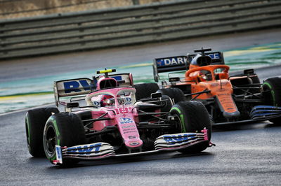 Lance Stroll (CDN) Racing Point F1 Team RP20 and Carlos Sainz Jr (ESP) McLaren MCL35 battle for position.