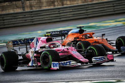 Lance Stroll (CDN) Racing Point F1 Team RP20 and Carlos Sainz Jr (ESP) McLaren MCL35 battle for position.