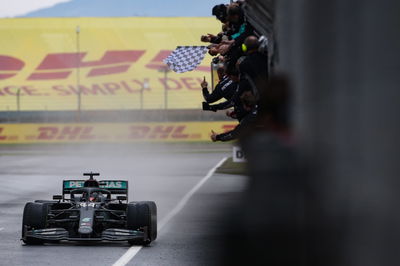 Race winner and World Champion Lewis Hamilton (GBR) Mercedes AMG F1 W11 celebrates as takes the chequered flag at the end of the race.