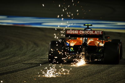 Lando Norris (GBR) McLaren MCL35 sends sparks flying.