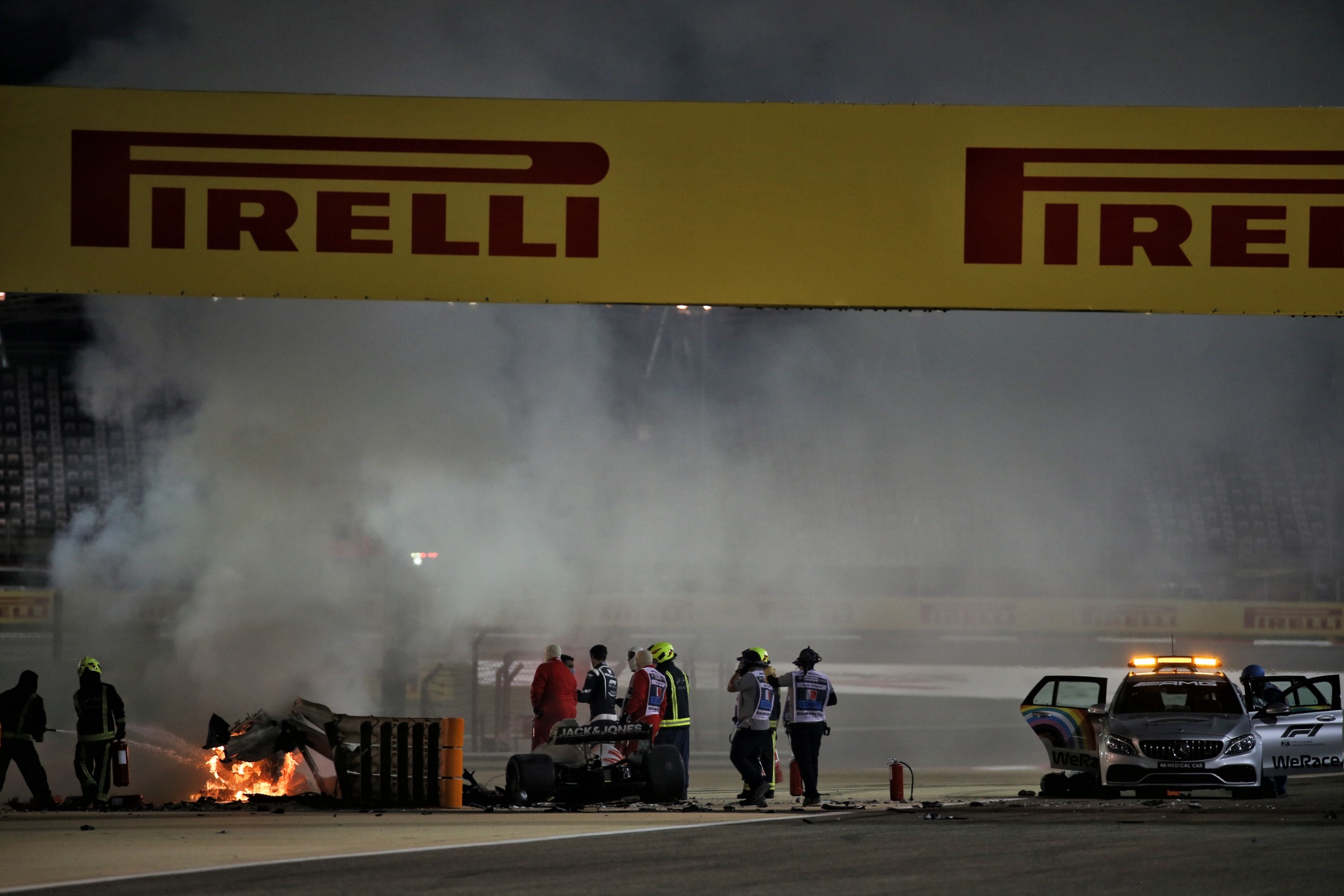 Marshals put out the fire of after Romain Grosjean (FRA) Haas F1 Team VF-20 crashed at the start of the race and exploded into flames.