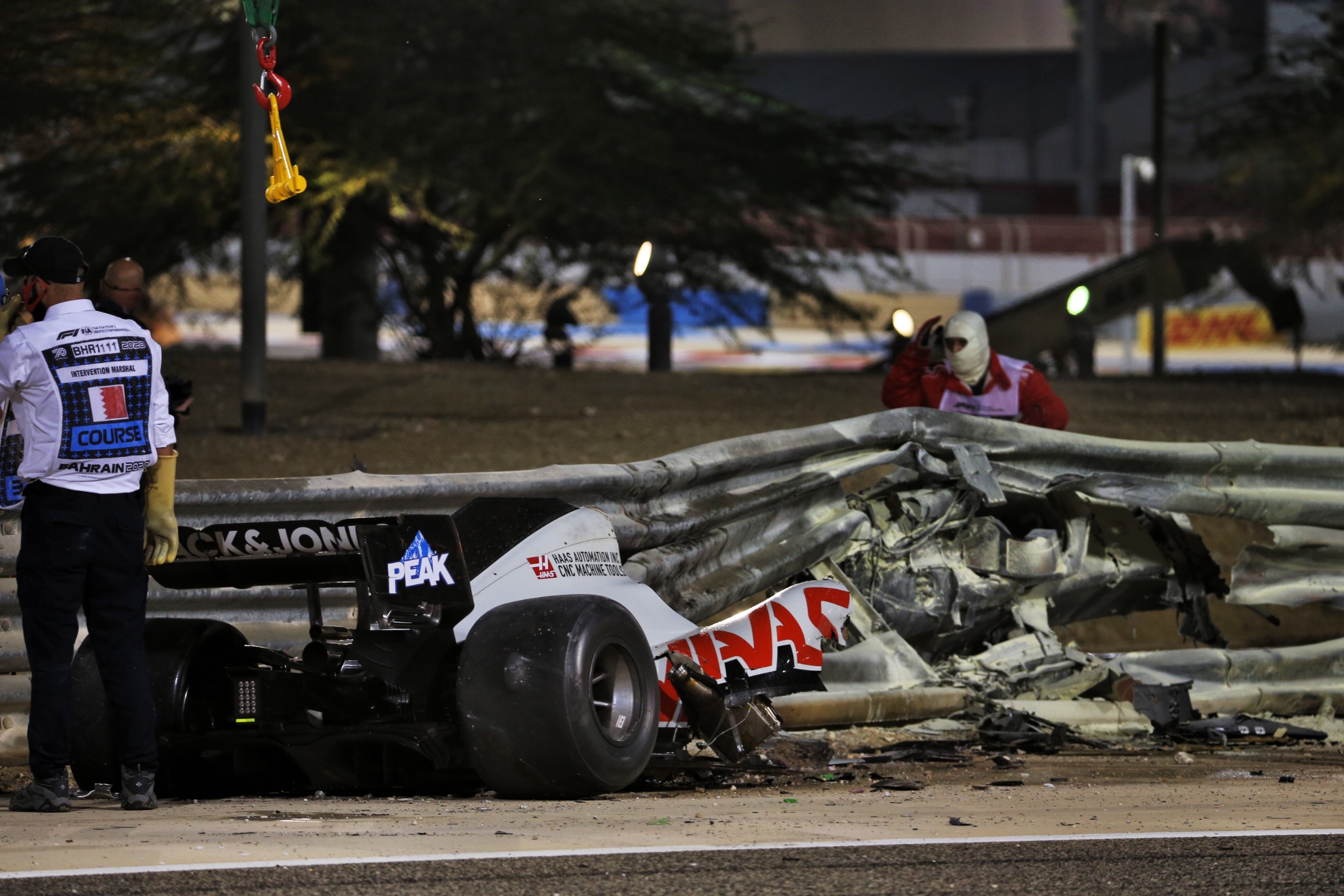 The heavily damaged Haas F1 Team VF-20 of Romain Grosjean (FRA) Haas F1 Team after crashed at the start of the race and exploded into flames, destroying the armco barrier.