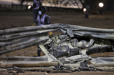 The heavily damaged Haas F1 Team VF-20 of Romain Grosjean (FRA) Haas F1 Team after crashed at the start of the race and exploded into flames, destroying the armco barrier.