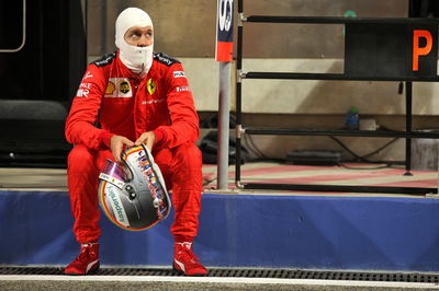 Sebastian Vettel (GER) Ferrari in the pits while the race is stopped.