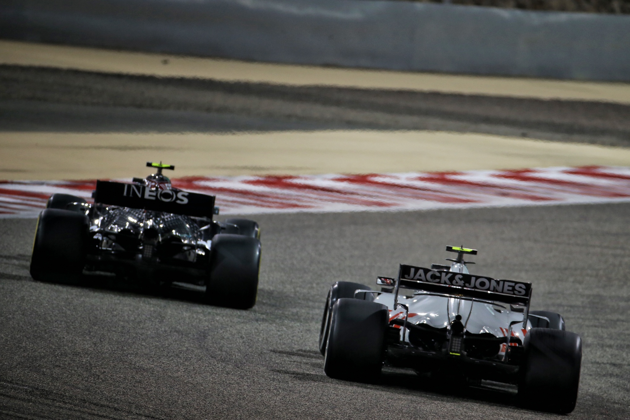 Kevin Magnussen (DEN) Haas VF-20 and Valtteri Bottas (FIN) Mercedes AMG F1 W11.