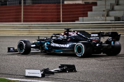 George Russell (GBR) Mercedes AMG F1 W11 passes the front wing of Jack Aitken (GBR) / (KOR) Williams Racing FW43.