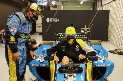 Fernando Alonso (ESP) Renault F1 Team with Esteban Ocon (FRA) Renault F1 Team in the Renault R25.