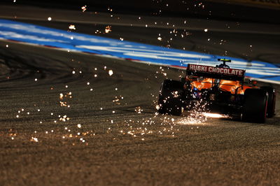 Lando Norris (GBR) McLaren MCL35M sends sparks flying.