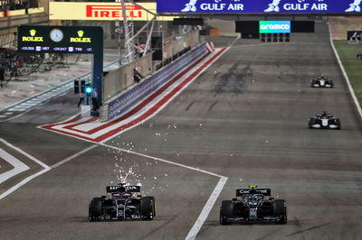 Yuki Tsunoda (JPN) AlphaTauri AT02 and Sebastian Vettel (GER) Aston Martin F1 Team AMR21 battle for position.