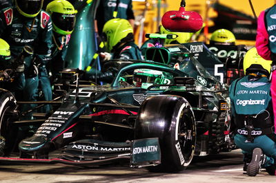 Sebastian Vettel (GER) Aston Martin F1 Team AMR21 makes a pit stop.