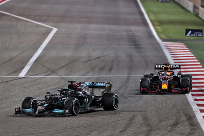 Lewis Hamilton (GBR) Mercedes AMG F1 W12 leads Max Verstappen (NLD) Red Bull Racing RB16B.