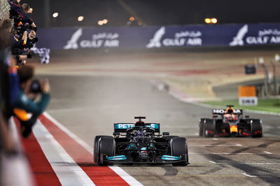 Race winner Lewis Hamilton (GBR) Mercedes AMG F1 W12 takes the chequered flag at the end of the race ahead of second placed Max Verstappen (NLD) Red Bull Racing RB16B.