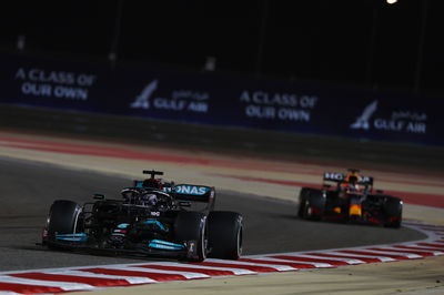 Lewis Hamilton (GBR) Mercedes AMG F1 W12 leads Max Verstappen (NLD) Red Bull Racing RB16B.