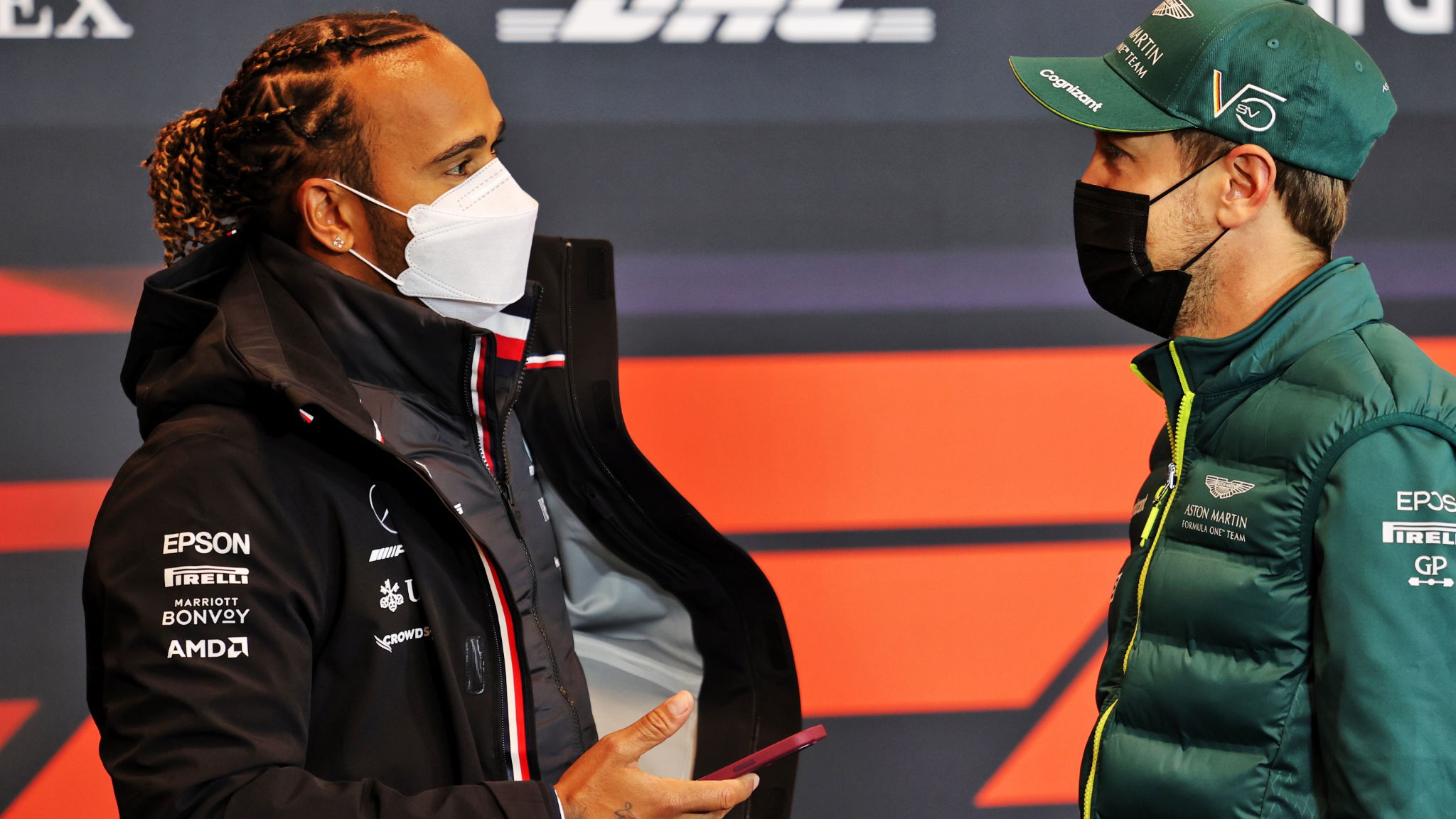 (L to R): Lewis Hamilton (GBR) Mercedes AMG F1 with Sebastian Vettel (GER) Aston Martin F1 Team in the FIA Press Conference.