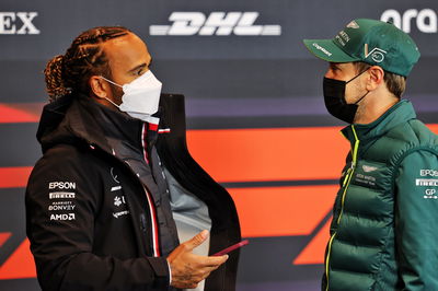 (L to R): Lewis Hamilton (GBR) Mercedes AMG F1 with Sebastian Vettel (GER) Aston Martin F1 Team in the FIA Press Conference.