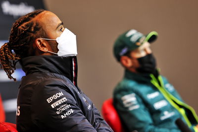 (L to R): Lewis Hamilton (GBR) Mercedes AMG F1 with Sebastian Vettel (GER) Aston Martin F1 Team in the FIA Press Conference.