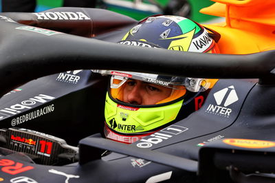 Sergio Perez (MEX) Red Bull Racing RB16B in the pits while the race is stopped.