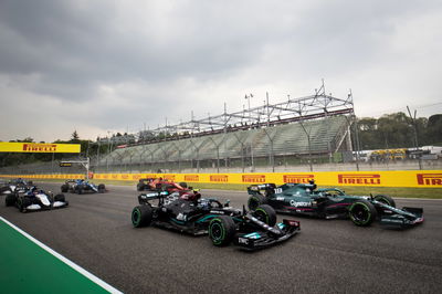 Lance Stroll (CDN) Aston Martin F1 Team AMR21 and Valtteri Bottas (FIN) Mercedes AMG F1 W12 at the start of the race.