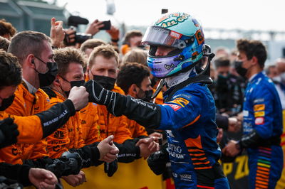 Daniel Ricciardo (AUS) McLaren with the team in parc ferme.