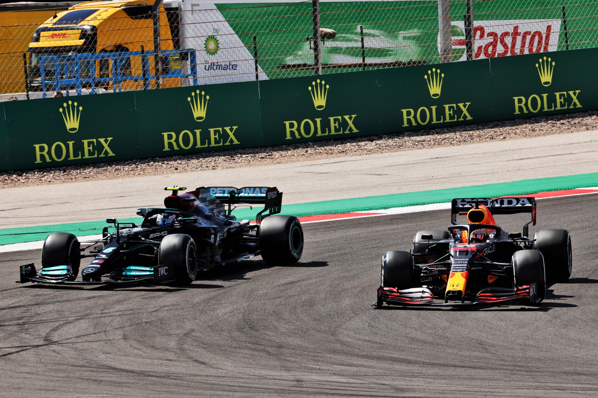 Max Verstappen (NLD) Red Bull Racing RB16B and Valtteri Bottas (FIN) Mercedes AMG F1 W12 battle for position.
