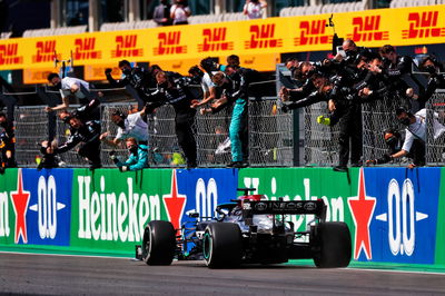 Race winner Lewis Hamilton (GBR) Mercedes AMG F1 W12 celebrates with the team at the end of the race.