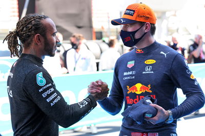 (L to R): Lewis Hamilton (GBR) Mercedes AMG F1 celebrates his 100th pole position in qualifying parc ferme with second placed Max Verstappen (NLD) Red Bull Racing.