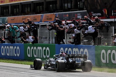 Race winner Lewis Hamilton (GBR) Mercedes AMG F1 W12 passes his celebrating team at the end of the race.