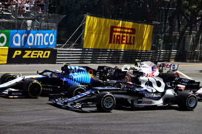 Yuki Tsunoda (JPN) AlphaTauri AT02 and Nicholas Latifi (CDN) Williams Racing FW43B at the start of the race.